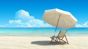 zdjęcie przedstawiające plażę nad morzem, na plaży leżak i parasol