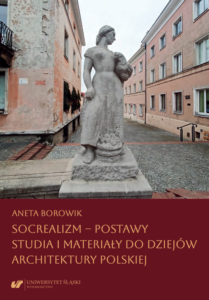 Okładka książki Anety Borowik przedstawiająca rzeźbę Przekupka dłuta Barbary Zbrożyny na tle budynków