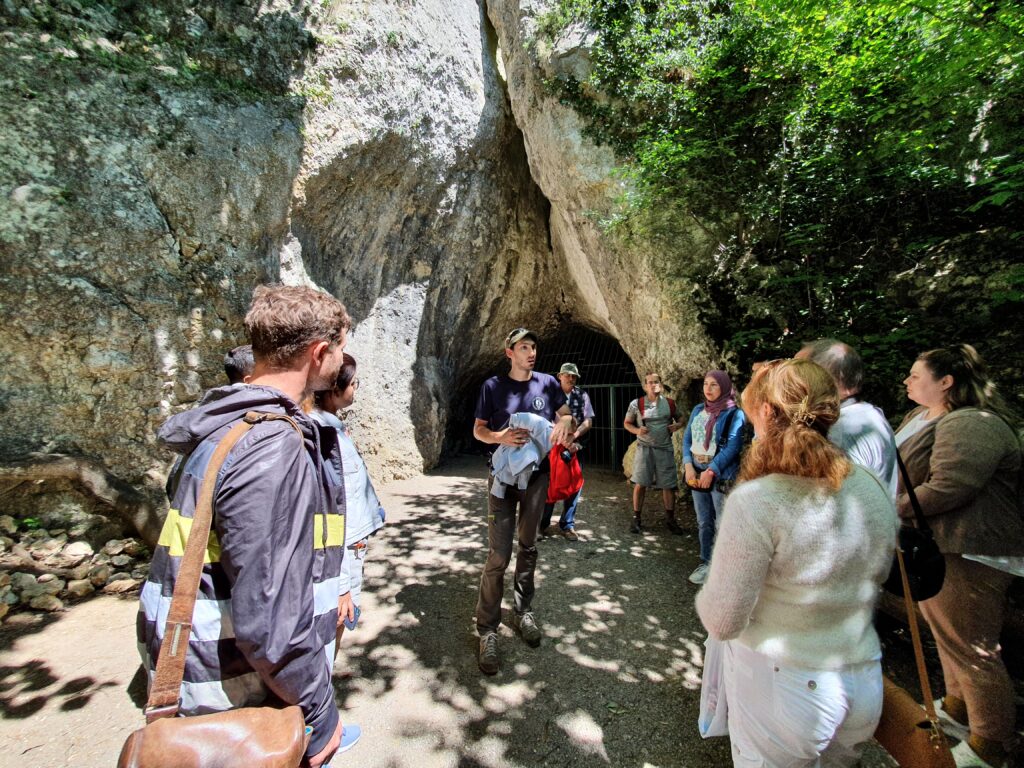 At the beginning of our excursion. Bat Cave. The cave guide tells us about the sightseeing rules.