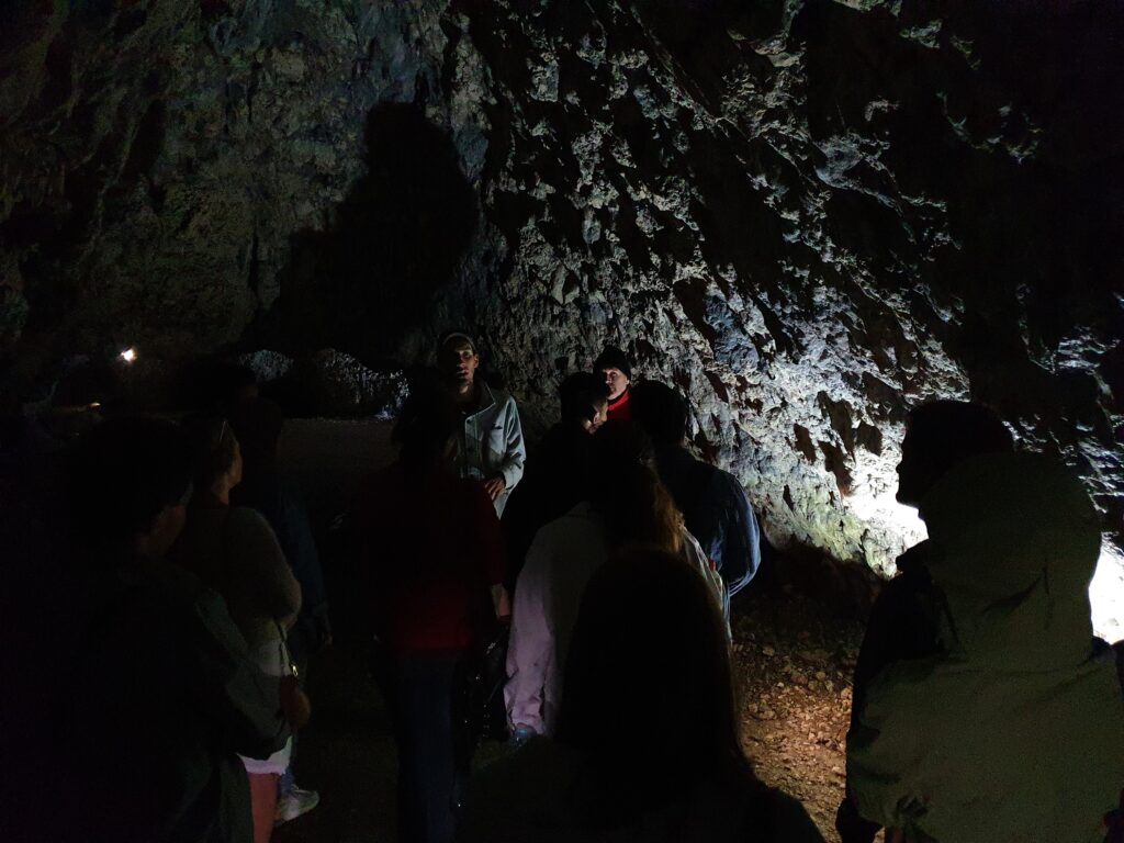 Bat Cave. The guide tells the story of the cave.