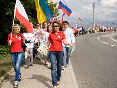 A group of young people with flags